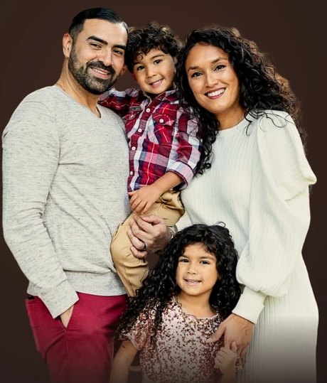 Santiago Flores with his wife and two children